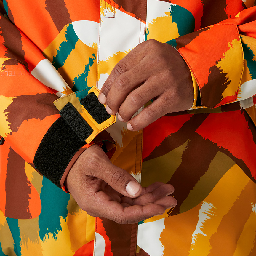 A detailed view of a colorful ski jacket.