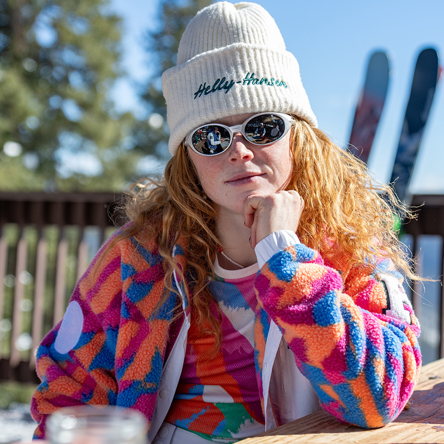 A woman wearing a colorful pile jacket.