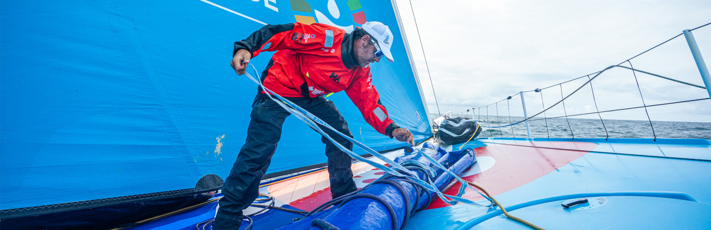 Sailor working on the deck of a sailing boat