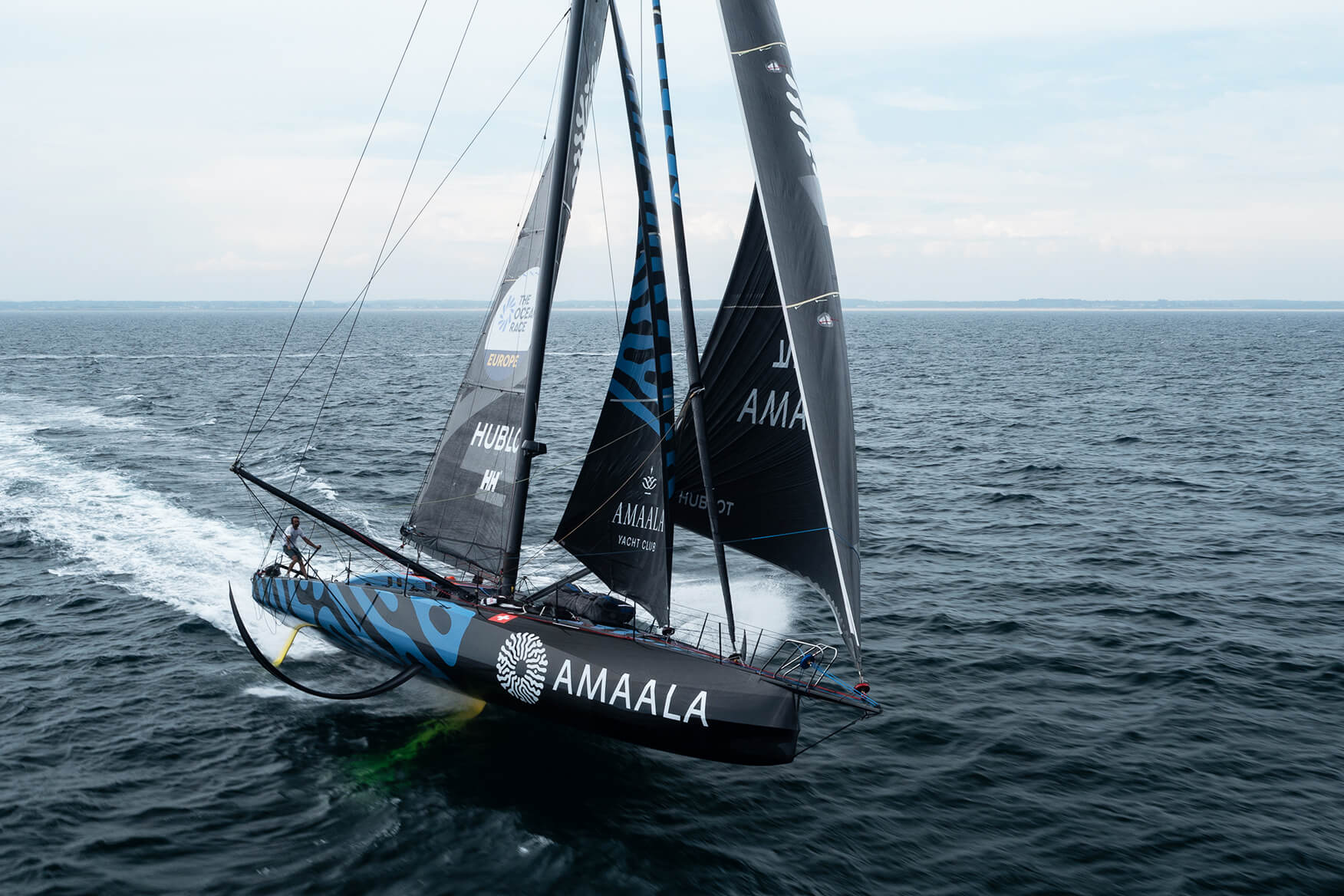 Team AMAALA training for The Ocean Race Europe 2025. Two sailors on the deck of an IMOCA sailing boat