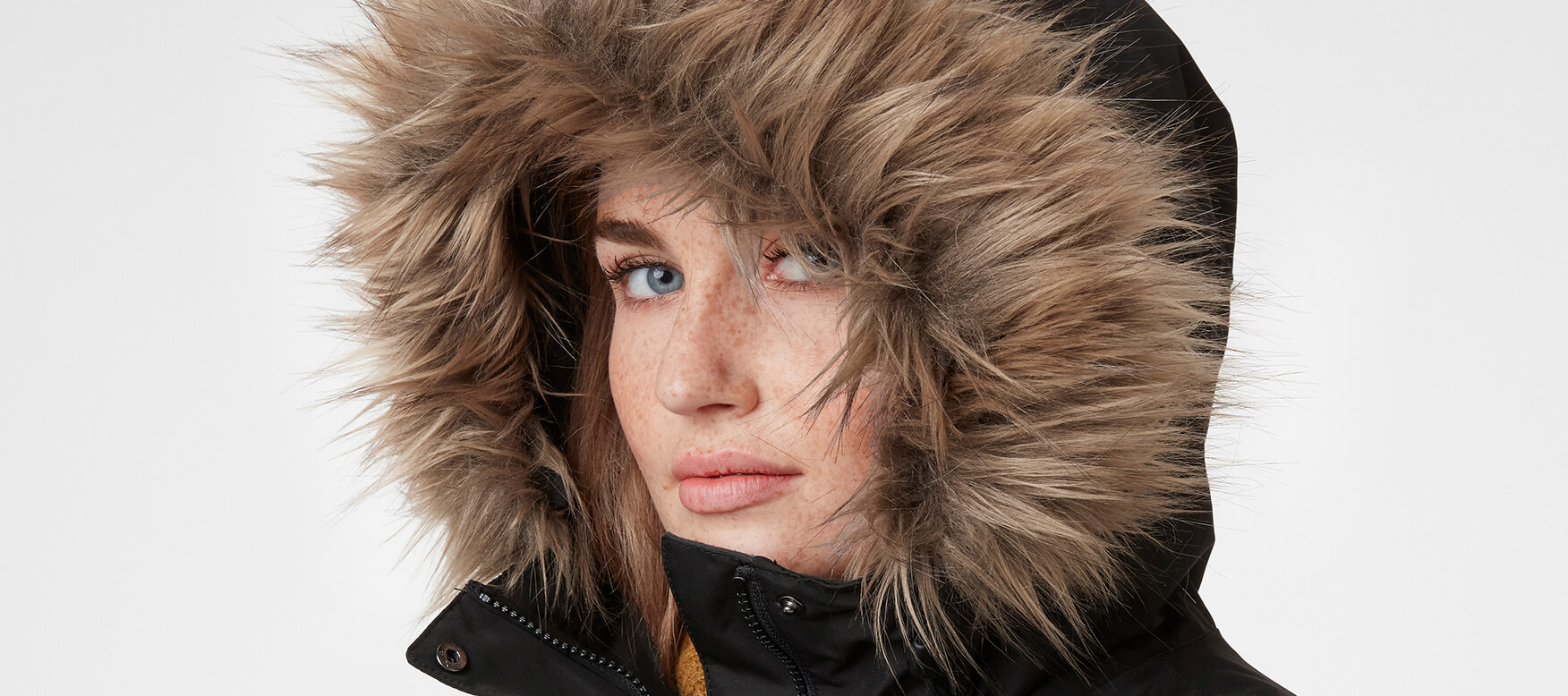 woman in a faux fur trimmed hood