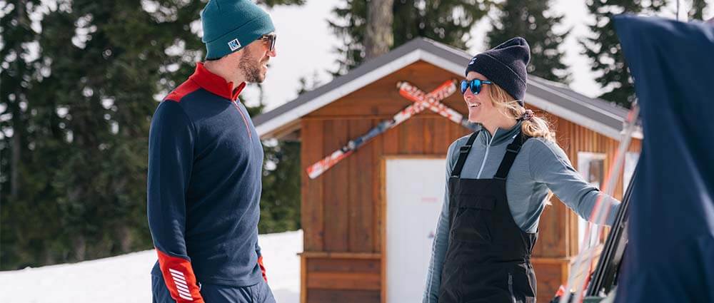 2 people talking outside on the mountain